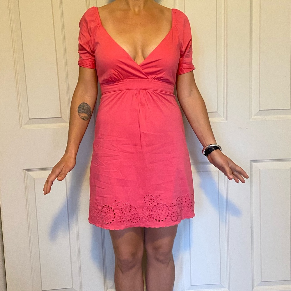 Bright and romantic pink dress with eyelet detailing.